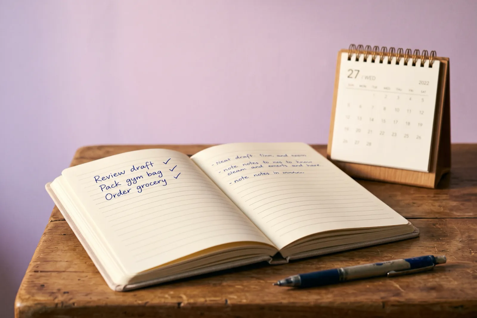 Illustration: an open notebook with a ticked checklist, beside a desk calendar turned to the next day.